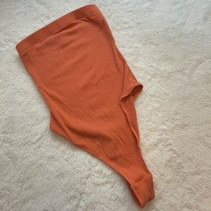 Orange ribbed body suit